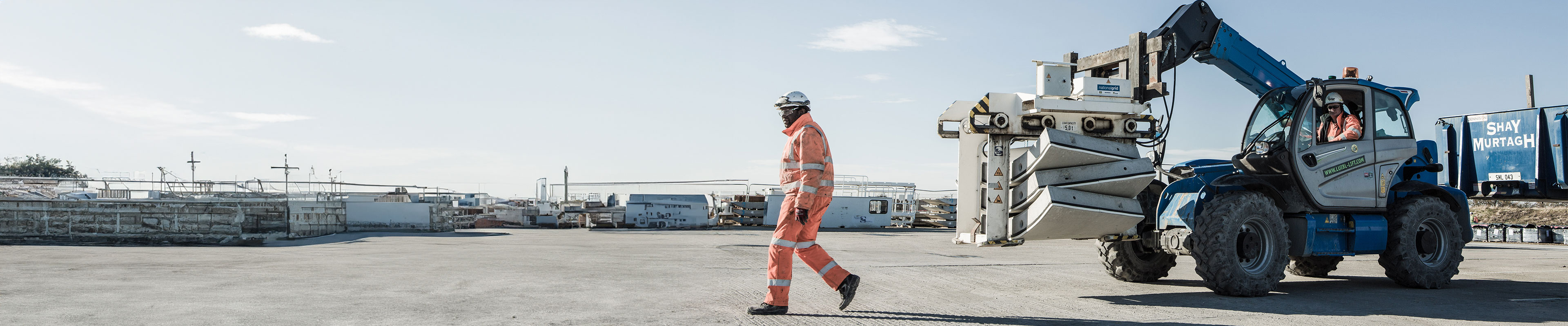 Picture of a construction worker walking torwards Humber Crossing